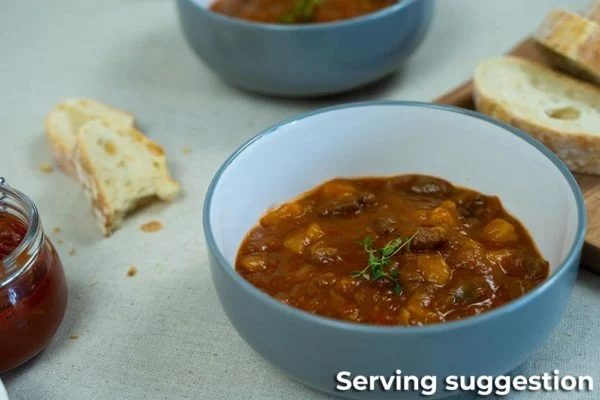 A Bowl of Beef Goulash Soup with Crusty Bread