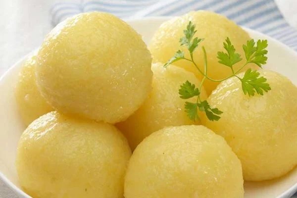 A Bowl of Kartoffelklöße (German Potato Dumplings) With Garnish
