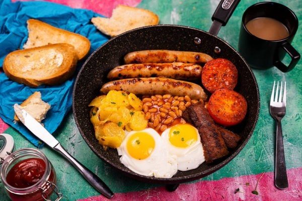 Full English Breakfast In Frying Pan on a Table