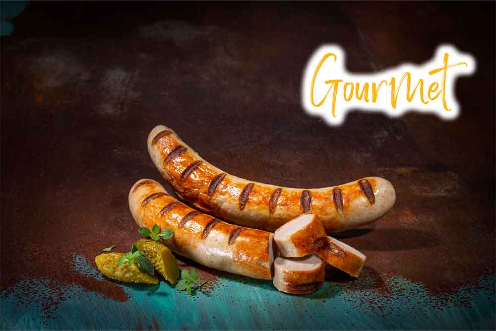 Two Cooked and Sliced Iberico Pork Gourmet Bratwurst Sausages with Gherkins