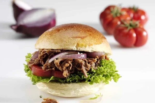 BBQ Pulled Beef, Lettuce, Onion and Tomato in a Bun