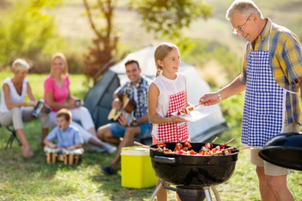 Father and daughter with bbq food for Father's Day